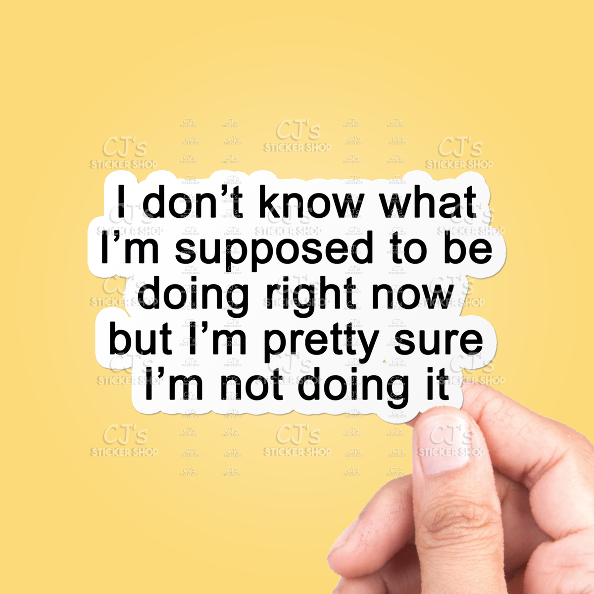 Hand holding a piece of paper with text on a yellow background