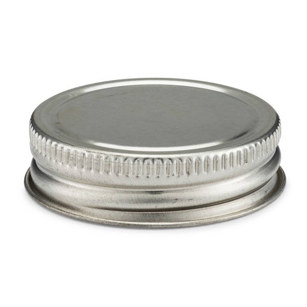 Metal jar lid on a white background