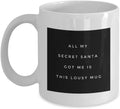 White mug with black label featuring humorous Secret Santa text