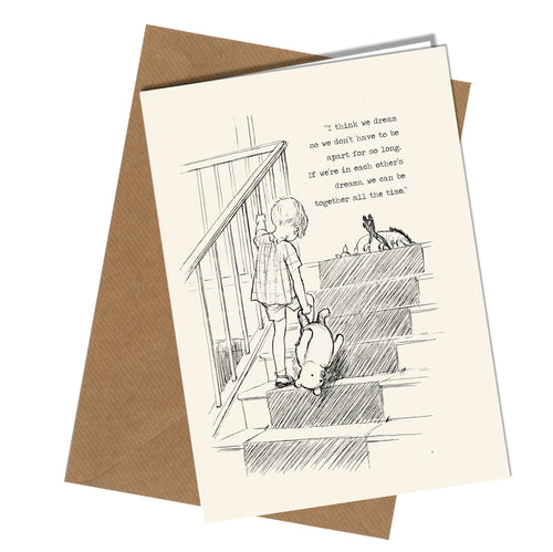 Greeting card with illustration of a child and dog on stairs, accompanied by a quote, with a brown envelope.