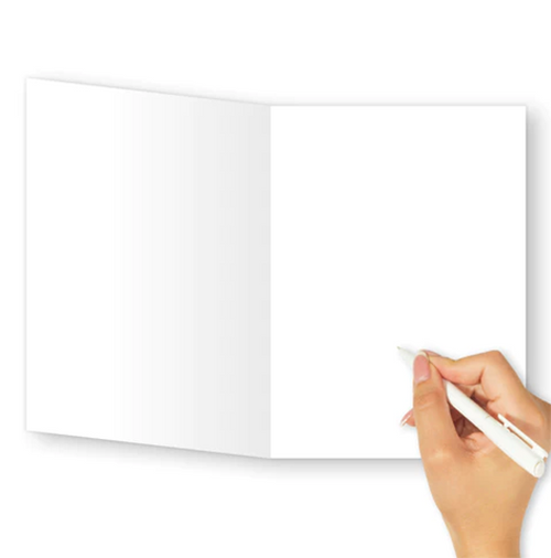 Hand holding a pen over an open notebook with blank pages on a white background