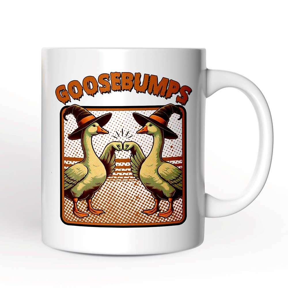 A white ceramic mug featuring a retro-style graphic of two geese wearing witch hats clinking glasses, with the word 'GOOSEBUMPS' above them in orange.