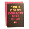 Card with humorous text and flames on a brown background with pink envelope