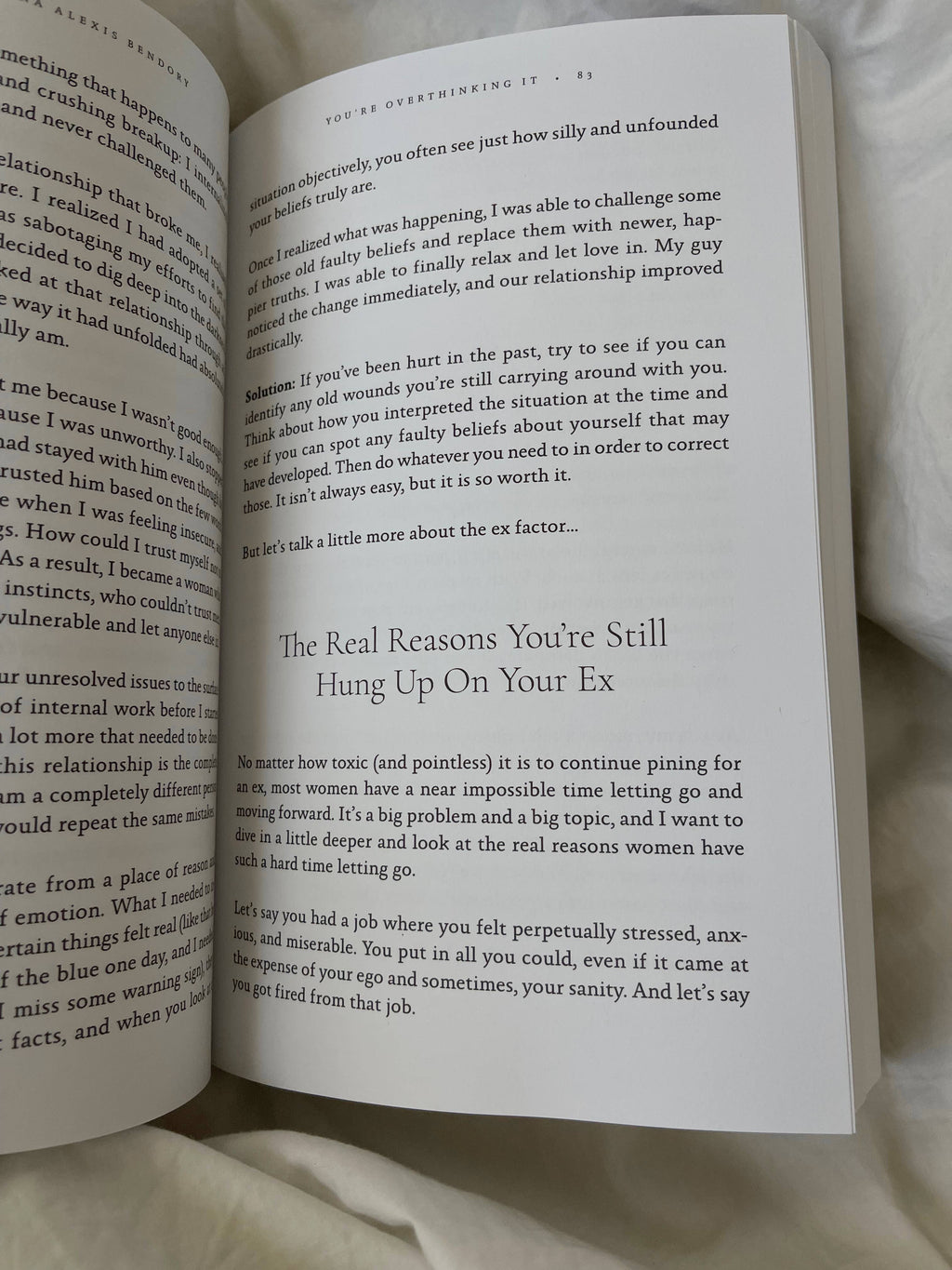 Open book with text on a white surface