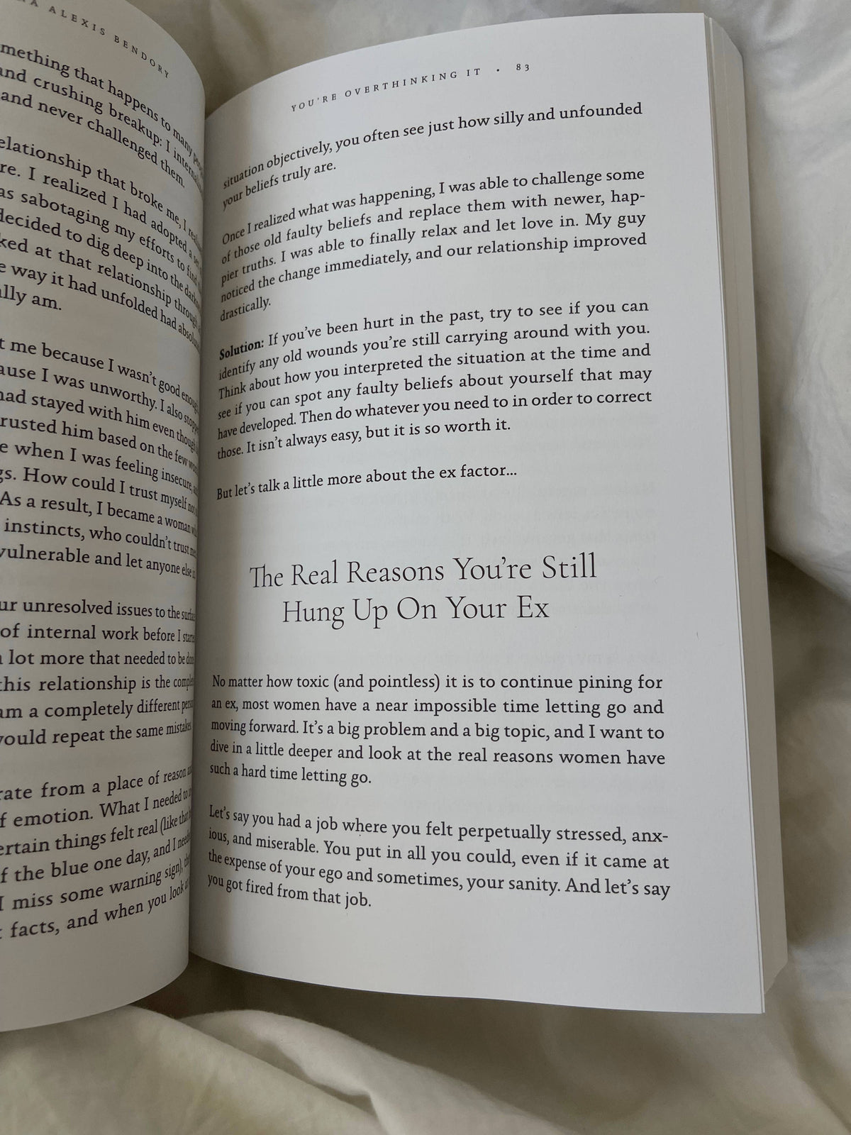 Open book with text on a white surface