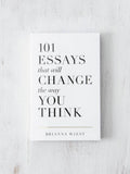 Book titled '101 Essays that will Change the Way You Think' by Brianna Wiest on a light wooden surface.
