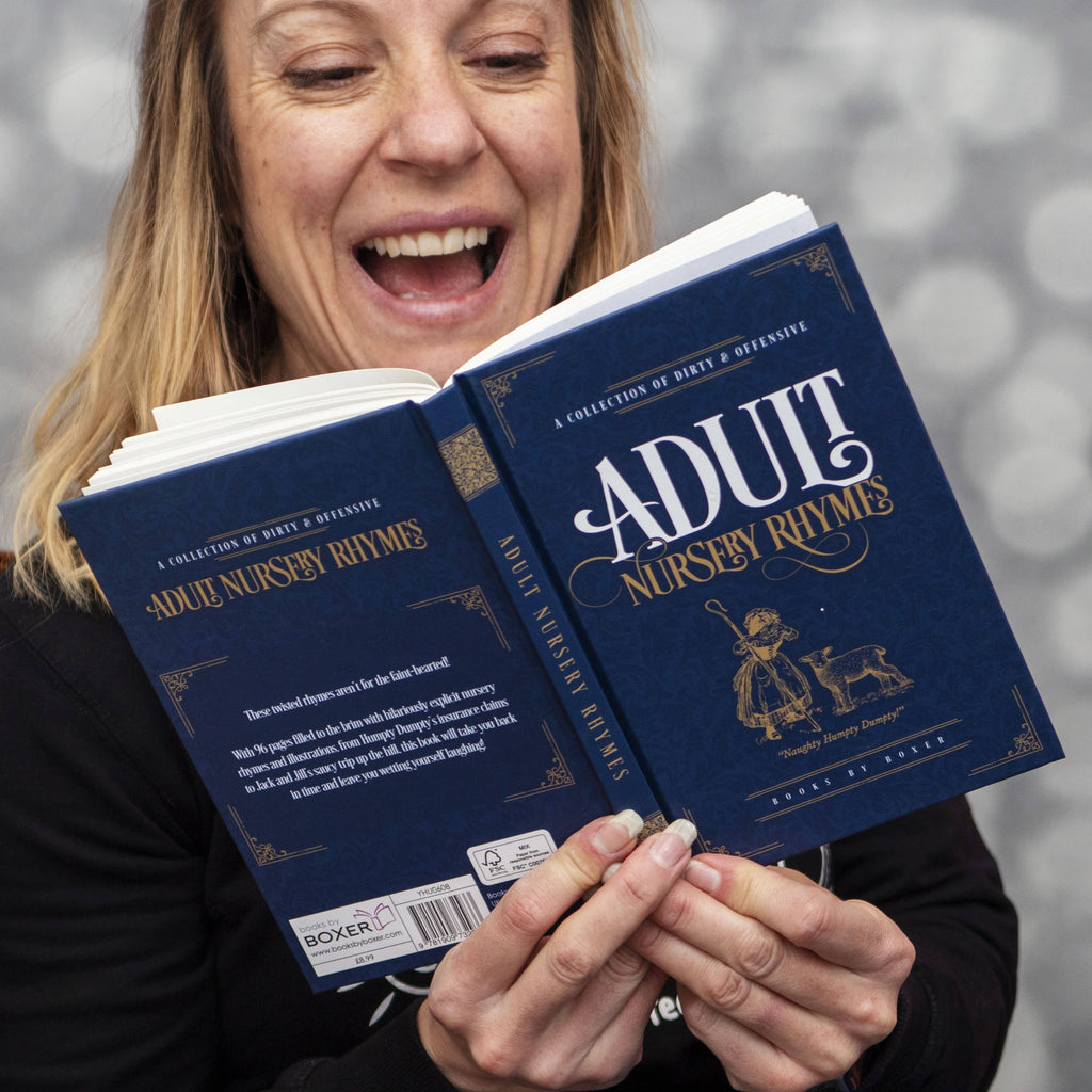 Person holding two copies of 'Adult Nursery Rhymes' book with a blurred background