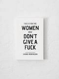 Book titled 'This is for the Women Who Don't Give a Fuck' by Janne Robinson on a textured white background