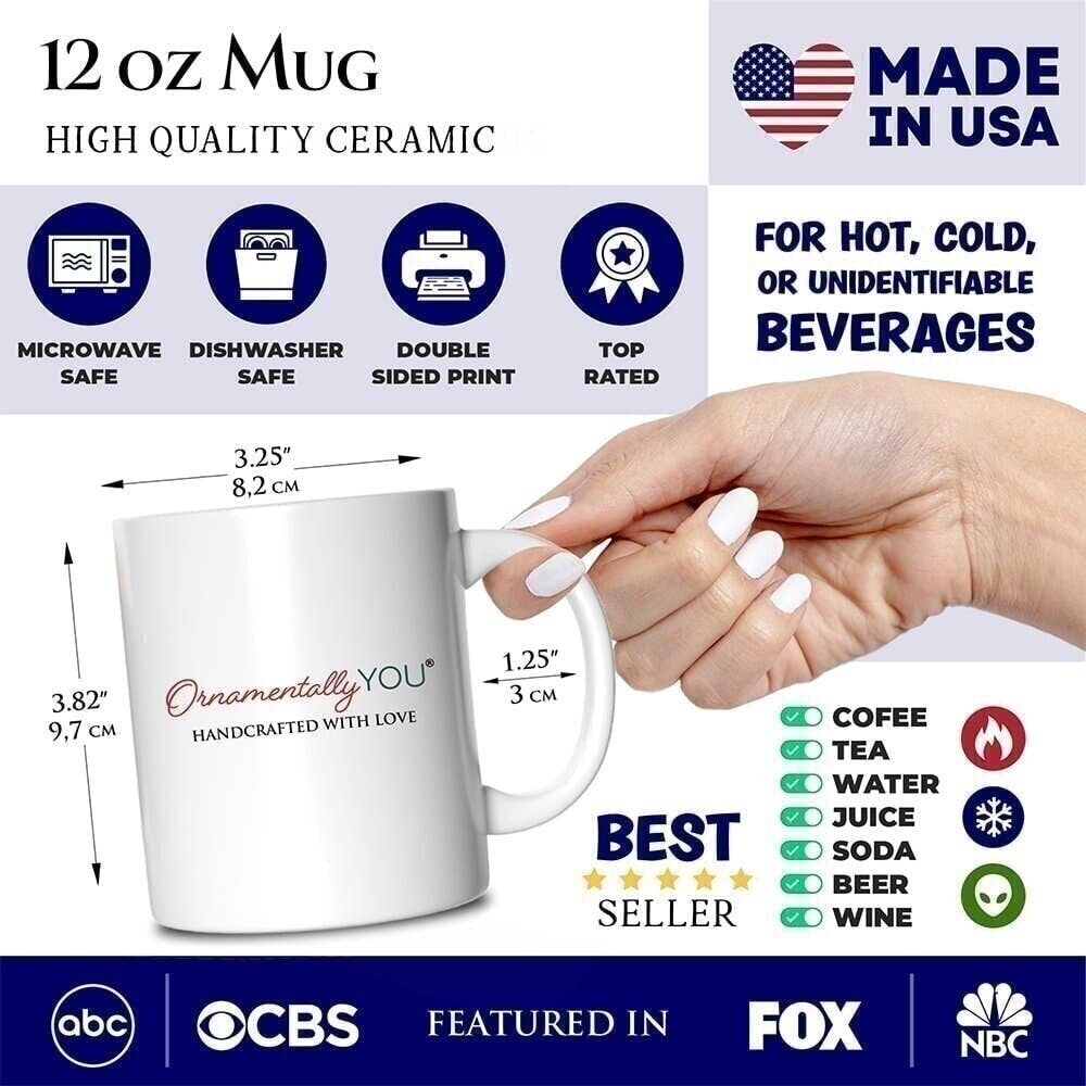 12 oz mug with measurement details and safety features, held by a hand.