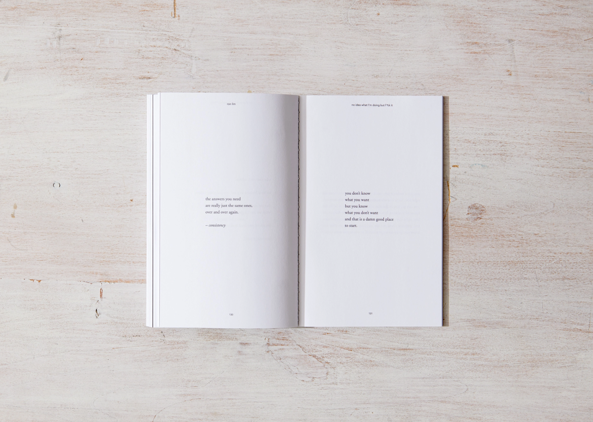 Open book with white pages on a light wooden surface