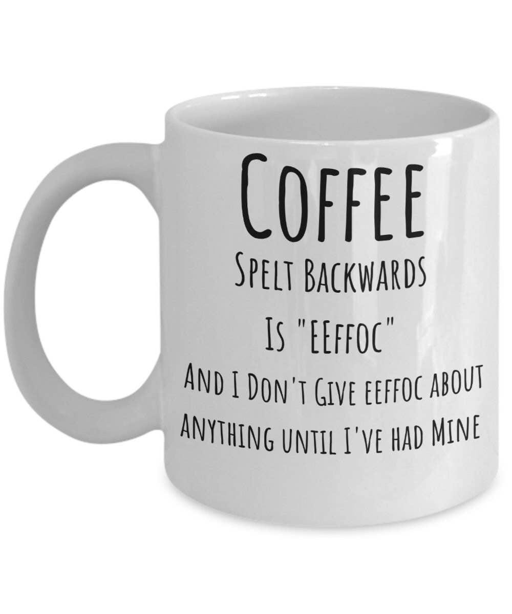 White mug with humorous text about coffee on a white background