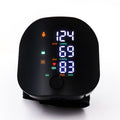 Digital blood pressure monitor with a black casing on a white background