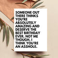 Motivational quote on a white card with leaves on a beige background