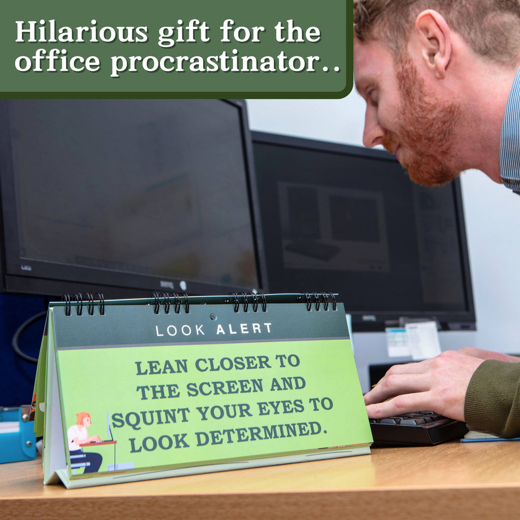 Desk calendar with humorous message on a desk in an office setting