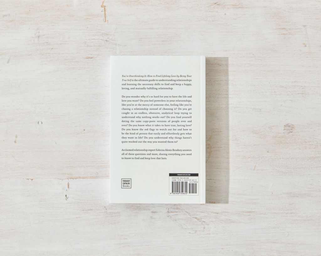 Back cover of a book on a light wooden surface
