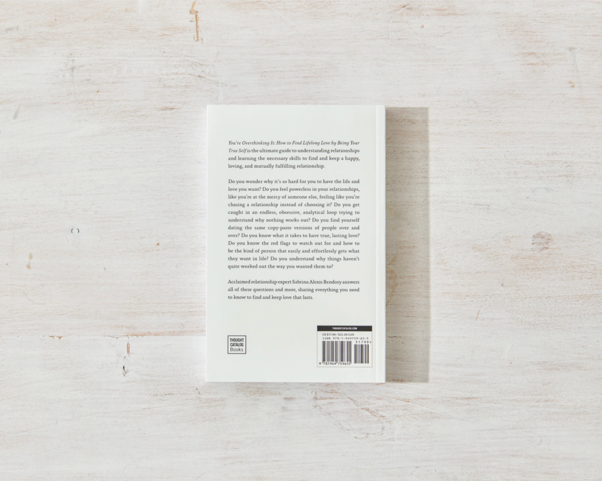 Back cover of a book on a light wooden surface