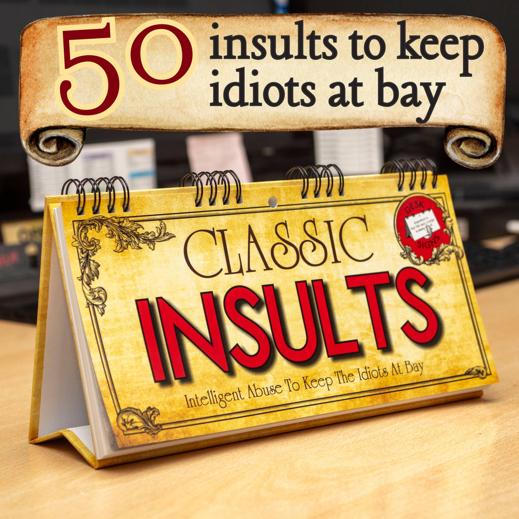 Calendar titled '50 Insults to Keep Idiots at Bay' on a wooden surface