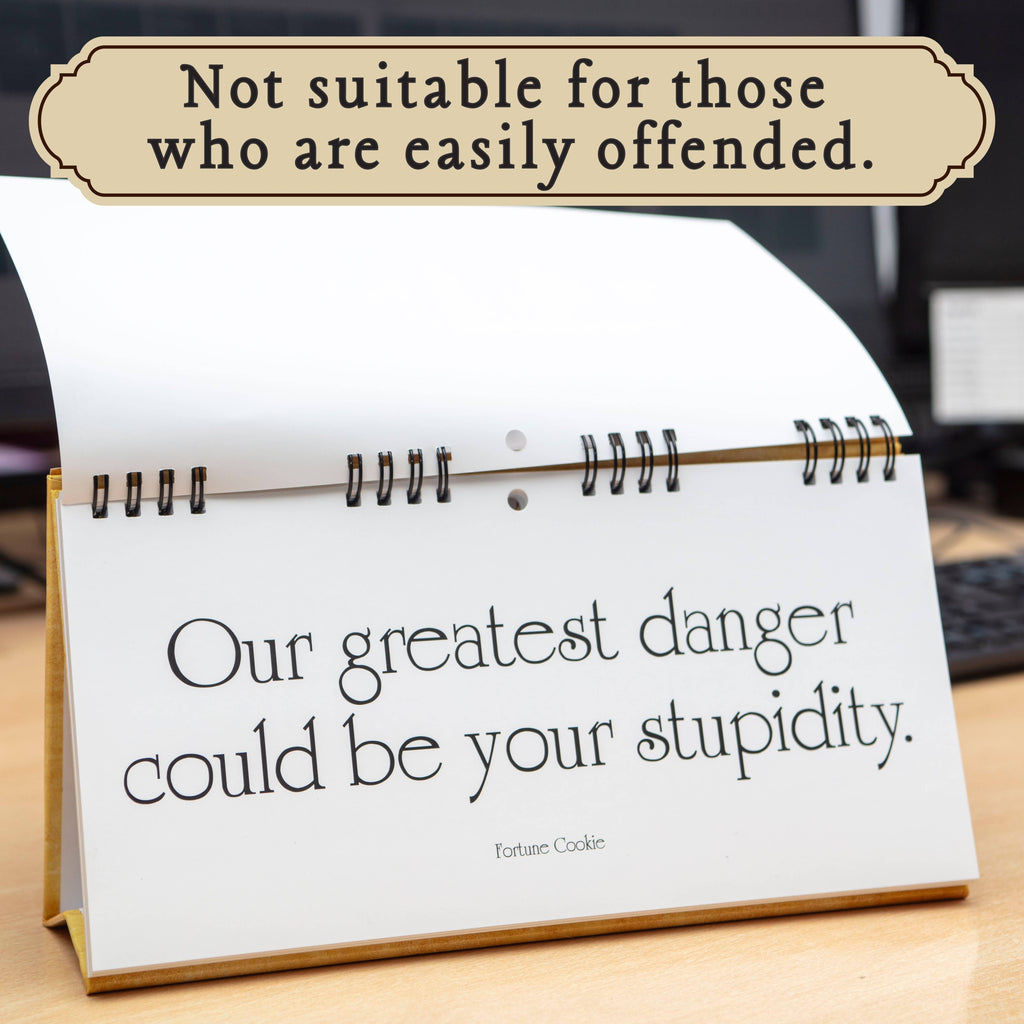 Desk calendar with a quote on a wooden surface