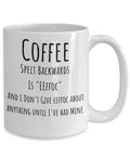 White mug with humorous text about coffee on a white background