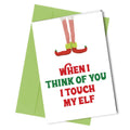 Card with elf design and text 'When I think of you I touch my elf' on a white background with a green envelope.