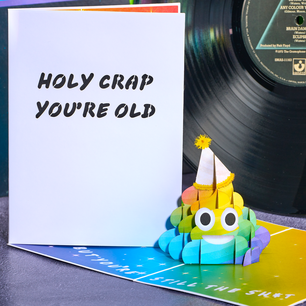 Colorful birthday cake pop-up card with a vinyl record in the background