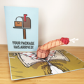 Pop-up card with mailbox and envelope design on a wooden surface