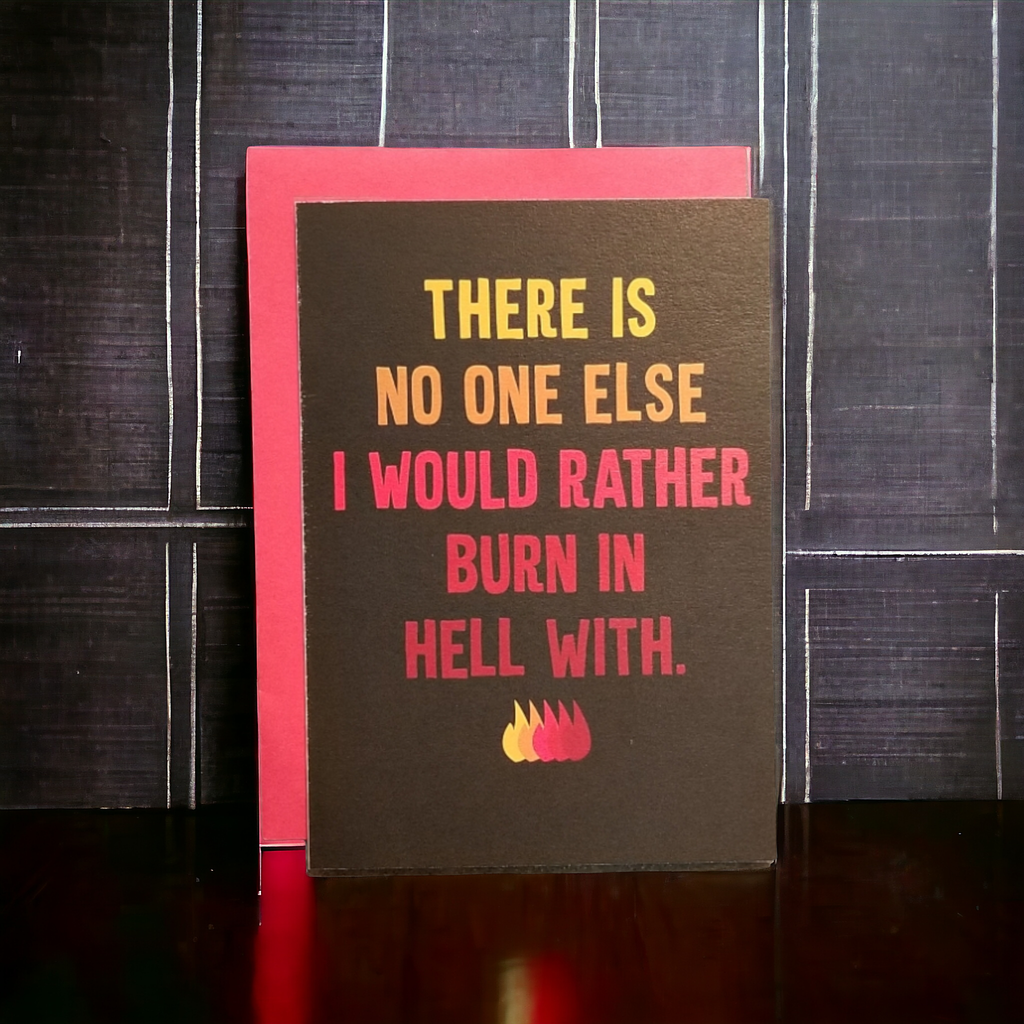 Card with humorous text and flames on a dark background