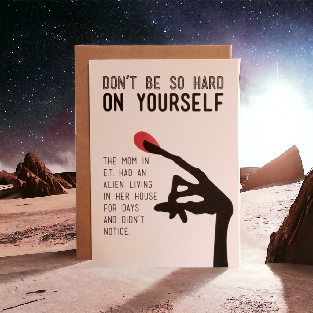 Card with humorous message about ET and an alien in a desert landscape