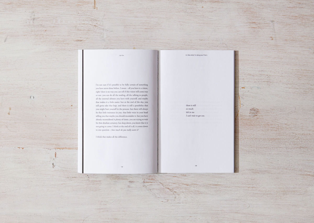 Open book on a wooden surface with text visible
