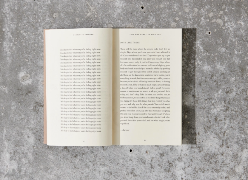 Open book on a textured gray surface