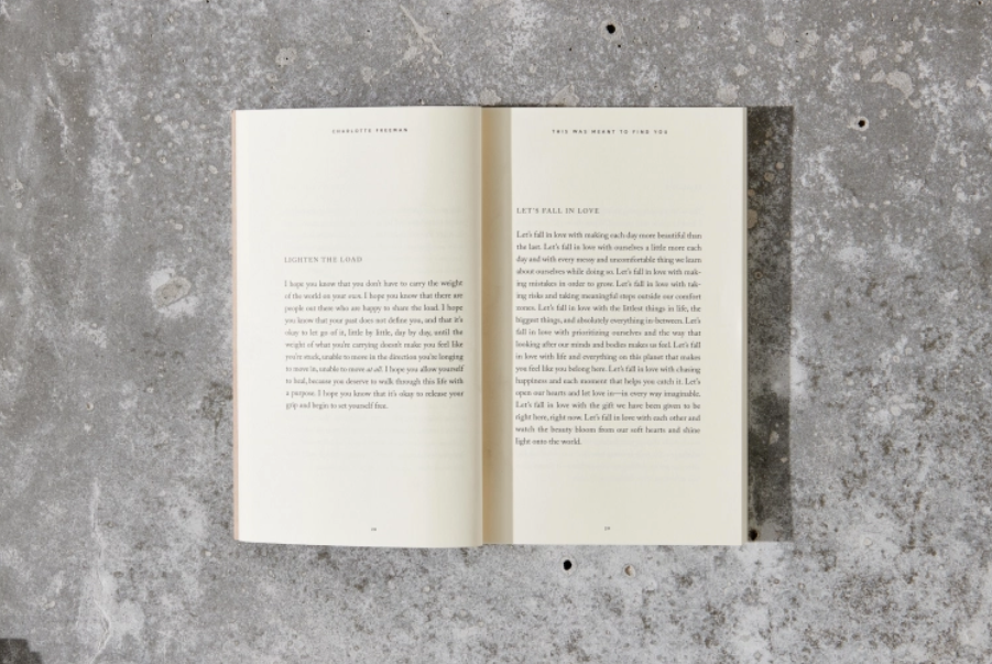 Open book on a textured gray surface