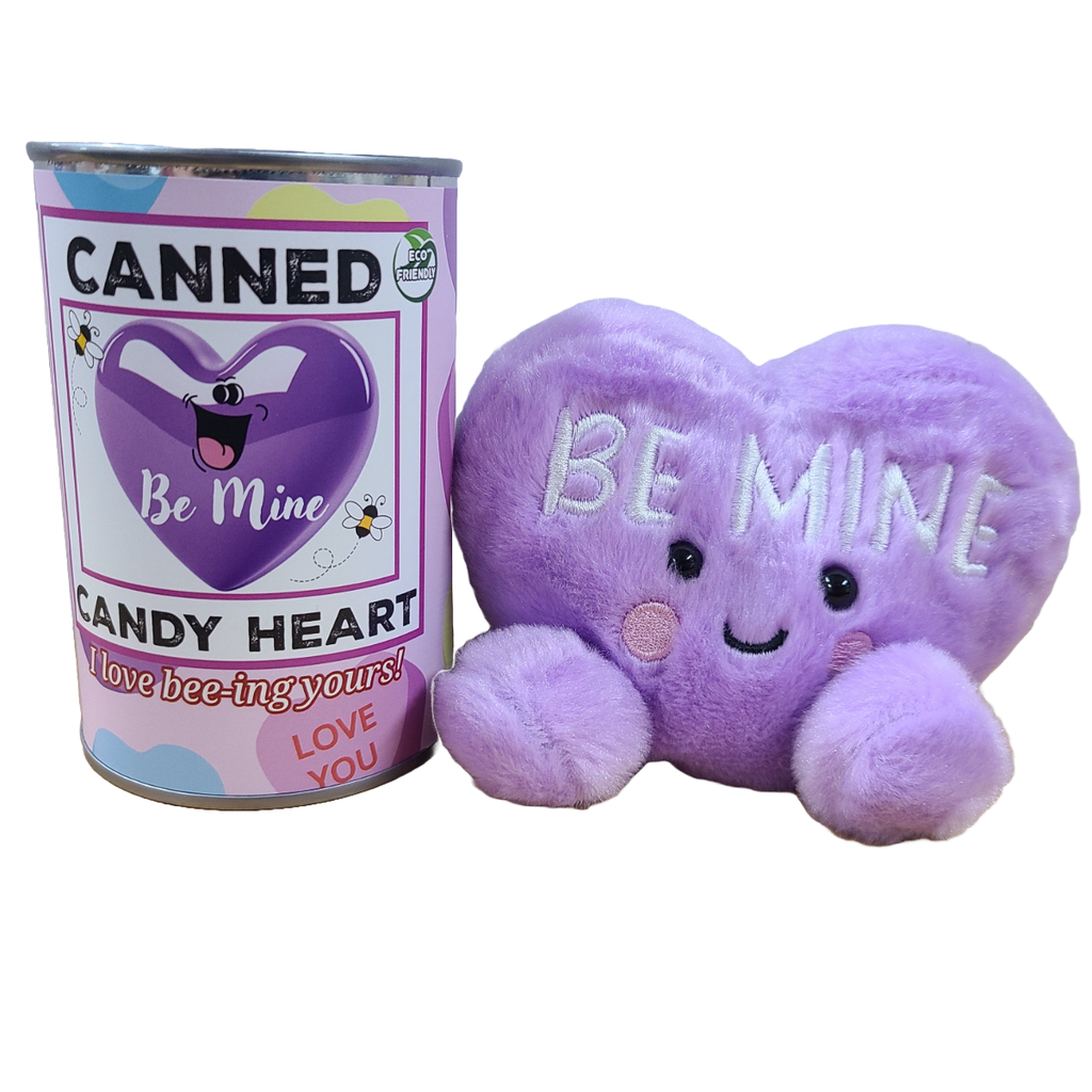 Purple candy heart plush toy with 'Be Mine' text next to a can labeled 'Canned Candy Heart'.