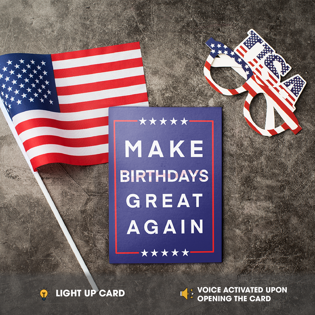 American flag, 'Make Birthdays Great Again' card, and novelty glasses on a textured surface